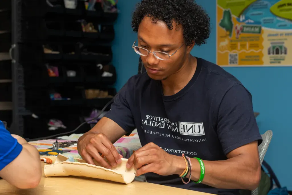 An Occupational Therapy student molds a wrist splint